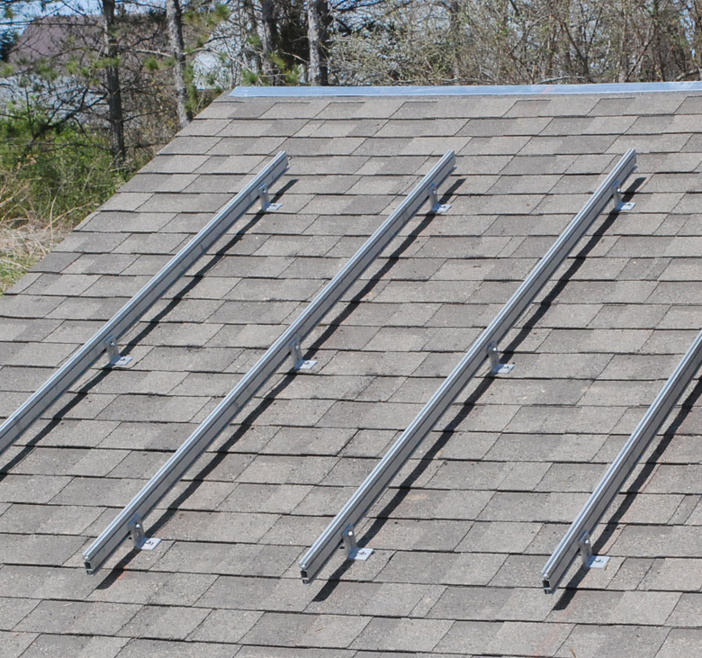 A picture of a roof with a set of Unirac mounting rails installed